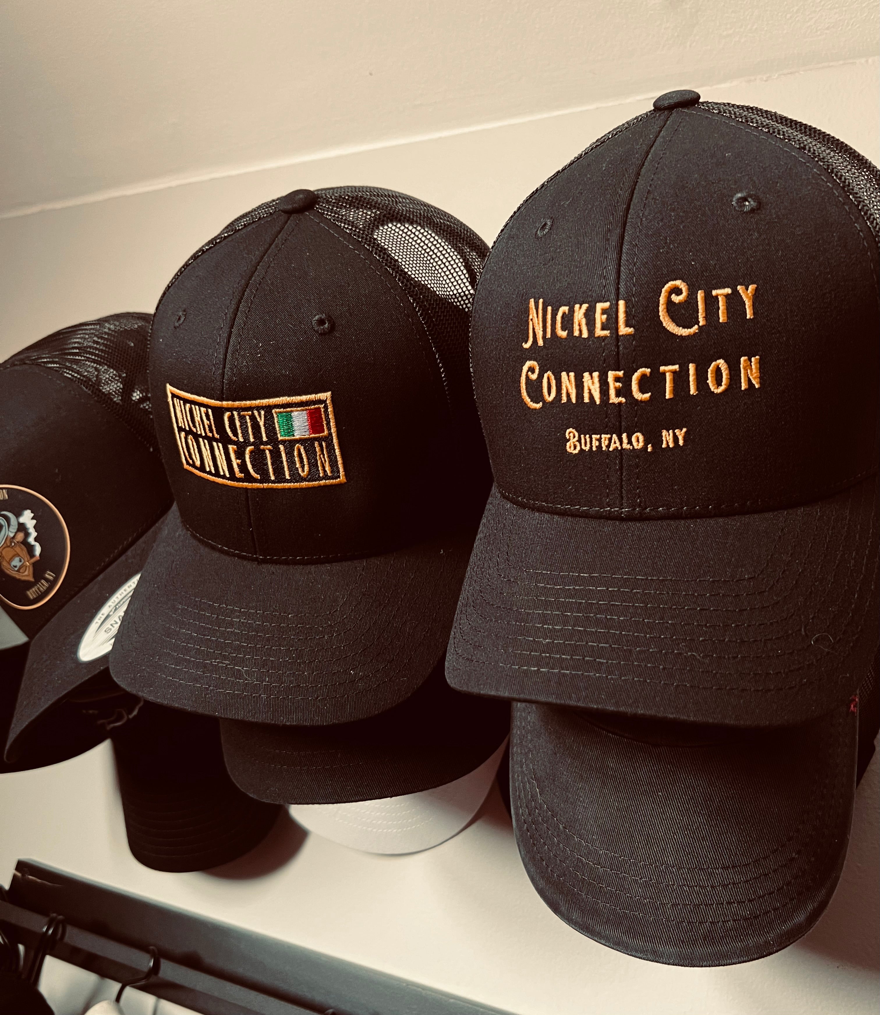 Nickel city connection hats hanging
