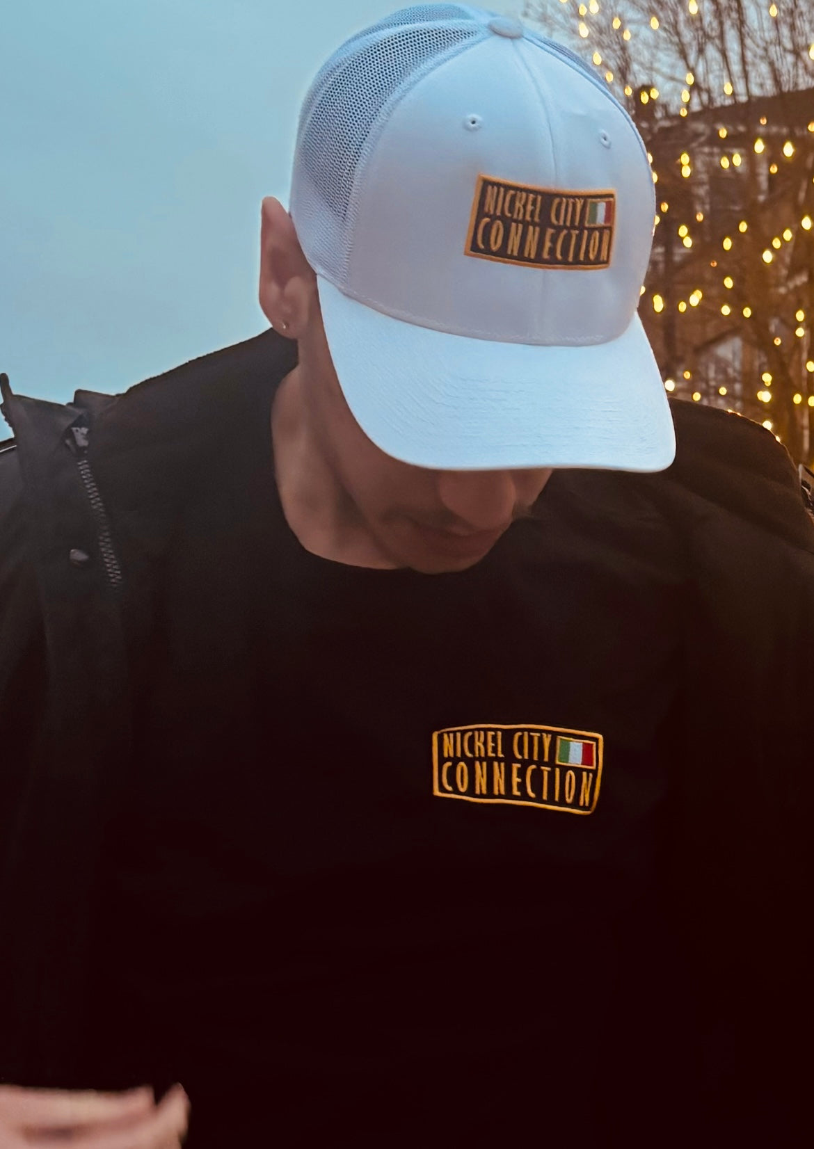 Man wearing nickel city connection hat with Italy flag
