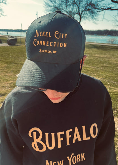 Man wearing nickel city connection hat