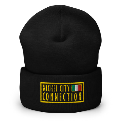 Black beanie featuring An embroidered patch design featuring the text "NICKEL CITY CONNECTION" in bold, yellow capital letters on a black background. The text is enclosed in a yellow rectangular border. To the right of the text, there is a small embroidered Italian flag with green, white, and red vertical stripes, also bordered in yellow. 