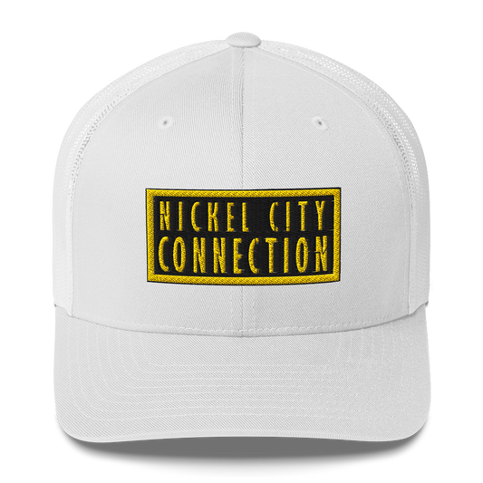 A white trucker-style cap with a black and yellow embroidered patch on the front. The patch has bold yellow text reading 'NICKEL CITY CONNECTION' inside a black background with a yellow border.