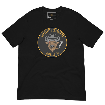 Black t-shirt with a Logo featuring a stylized bison head wearing a fedora, smoking a cigar with visible smoke. The circular design includes bold gold text reading 'Nickel City Connection' at the top and 'Buffalo, NY' at the bottom, outlined in gold against a black background.